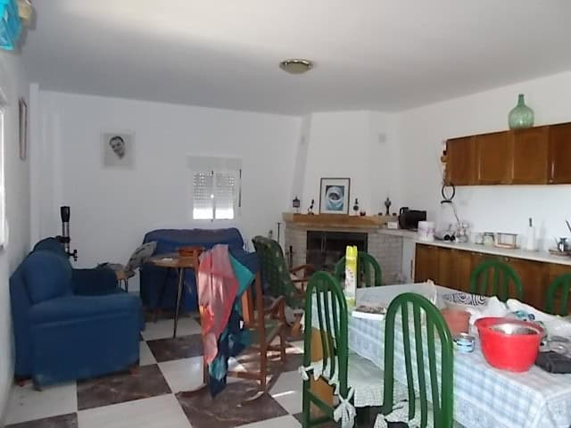 Charming interior of a rural property in Purchena, Almeria, featuring a living area, dining space, a.