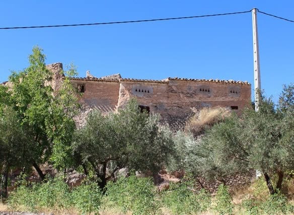 Rural property in Lucar, Almeria, featuring traditional architecture and surrounded by lush greenery.