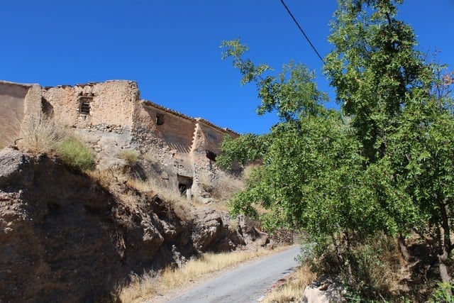 Rural property in Lucar, Almeria, featuring traditional stone buildings and scenic countryside views.