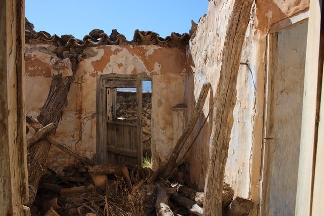 Rural property ruin in Lucar, Almeria with stone walls and open sky.