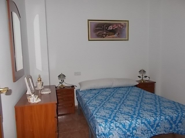 Charming apartment in Tijola, Almeria, featuring a comfortable bedroom with simple decor and natural.