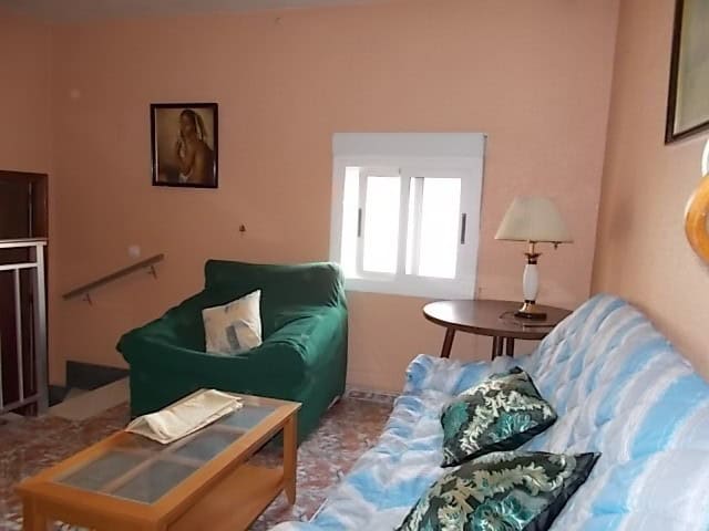 Bright living room with comfortable seating in Tijola, Almeria.