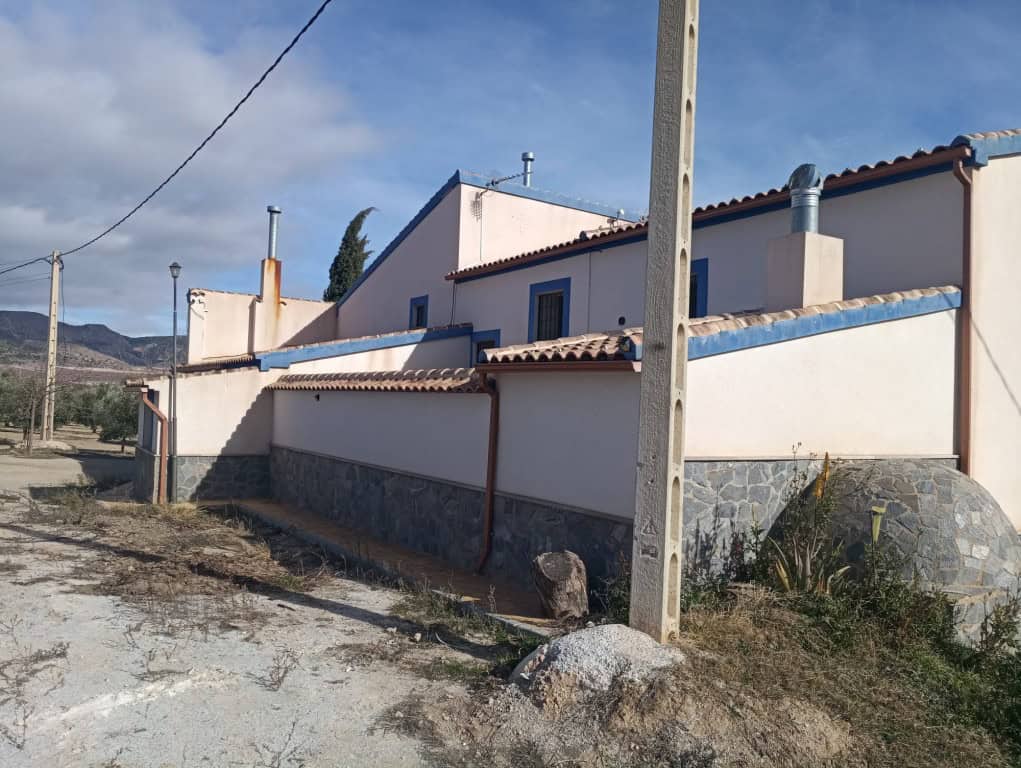 Commercial property for sale in Oria, Almeria, with traditional architecture and scenic surroundings.