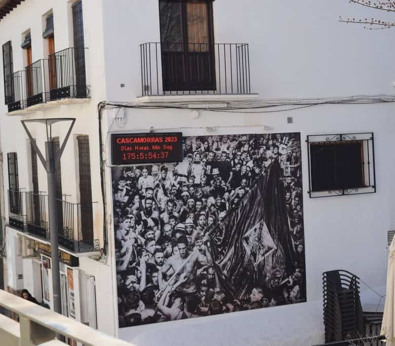 Commercial building in Baza, Granada with modern balconies and white facade.