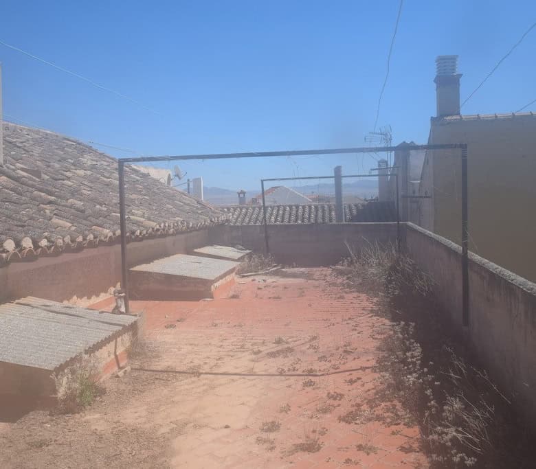 Rooftop commercial space in Baza, Granada with city views and outdoor area.