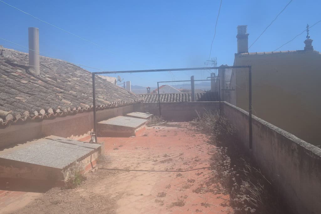 Rooftop commercial space in Baza, Granada with city views and outdoor area.
