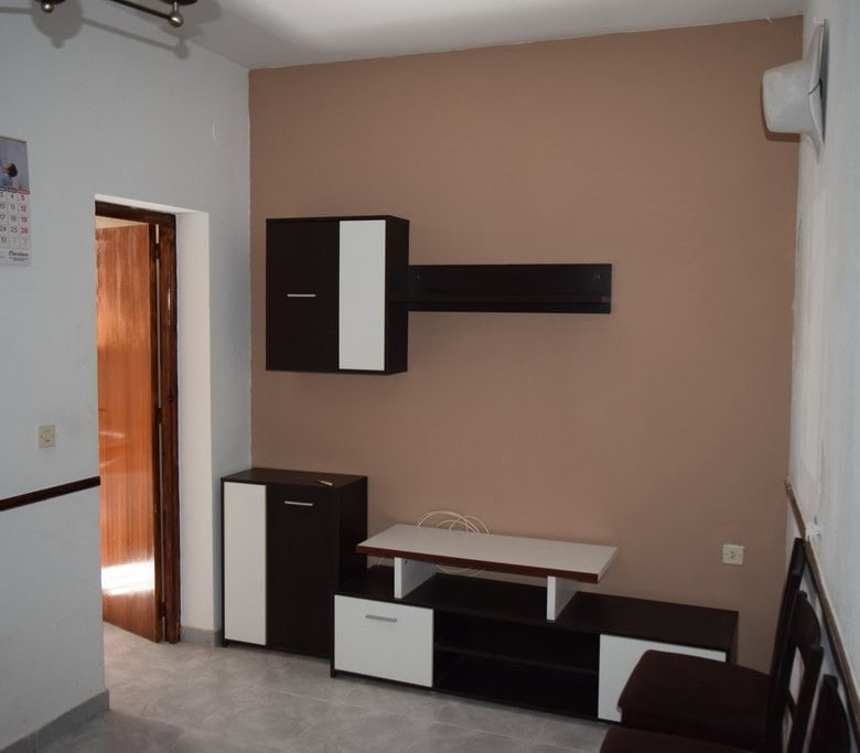 Traditional cave house interior in Baza, Granada, with modern furniture and cozy atmosphere.