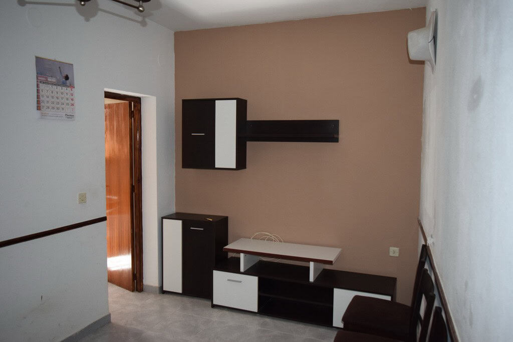 Traditional cave house interior in Baza, Granada, with modern furniture and cozy atmosphere.