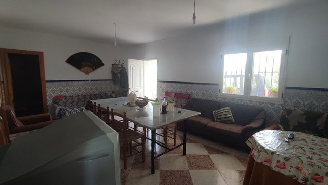 Charming interior of a rural property in Somontin, Almeria, featuring a living area with traditional.