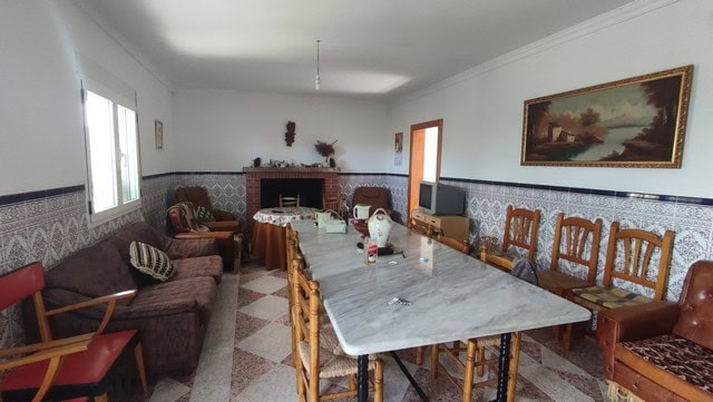 Rural property in Somontin, Almeria, featuring a spacious living room with traditional decor and amp.