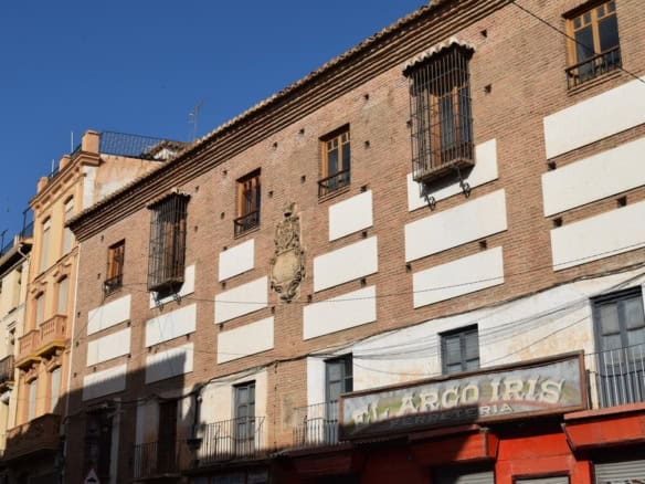 Town house for sale in Guadix, Granada with traditional architecture and charming balconies.