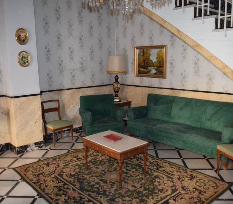 Town House interior in Guadix, Granada with vintage decor and classic furnishings.