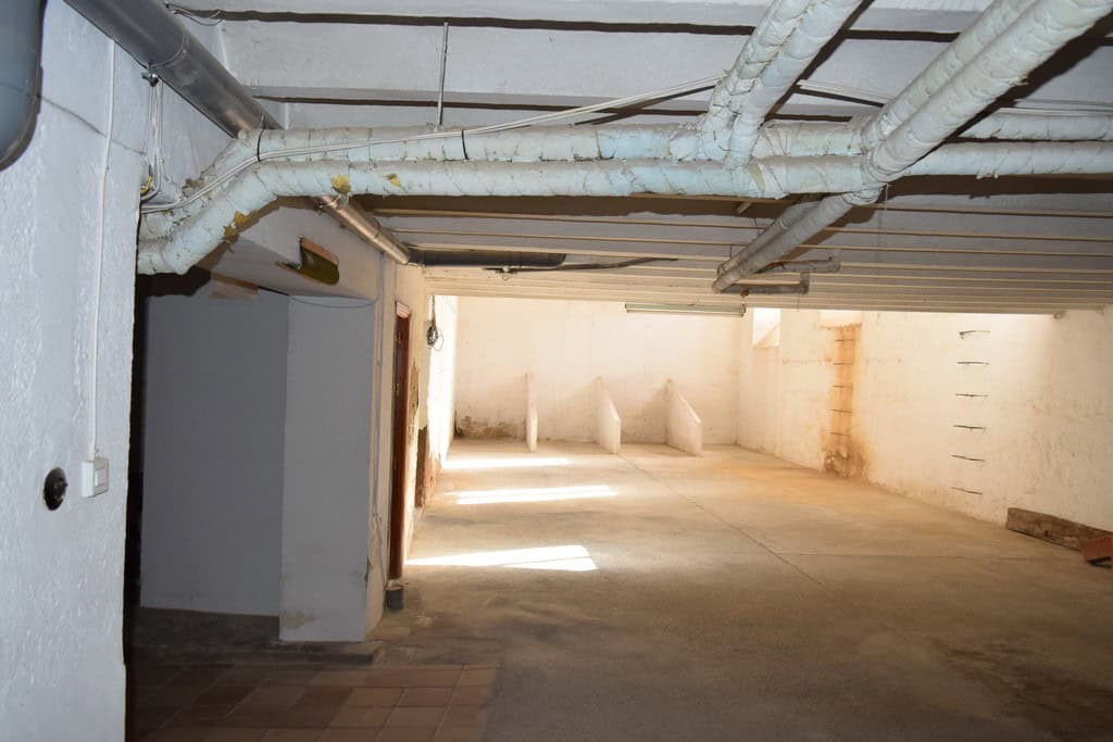 Spacious underground parking area in a town house located in Guadix, Granada.