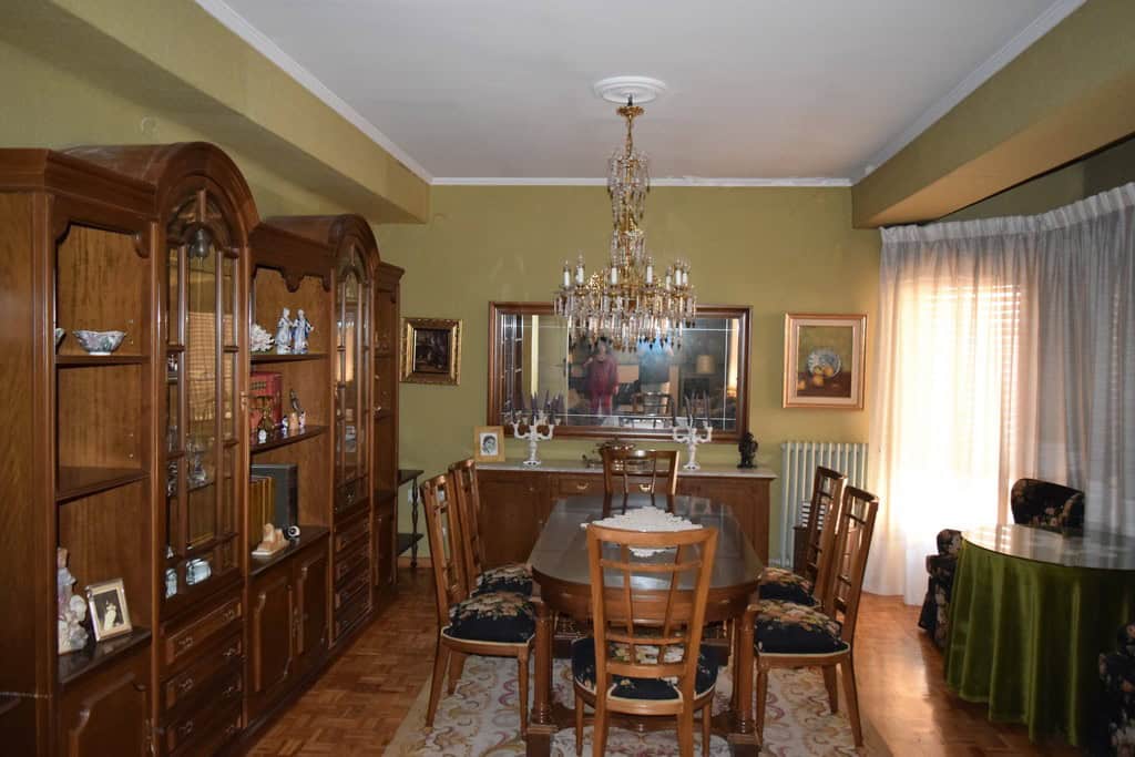 Town House interior in Guadix, Granada with classic furniture and chandelier.
