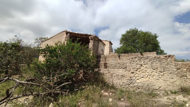 Old rural house in Tijola, Almeria, Spain, with stone walls and surrounding natural landscape.