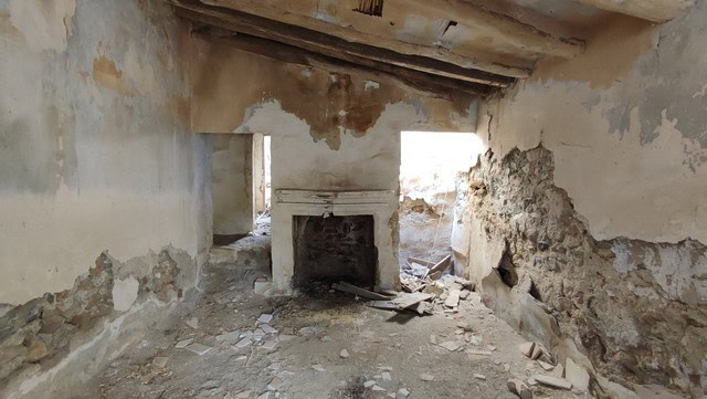 Old rustic interior with fireplace in Tijola, Almeria, Spain.