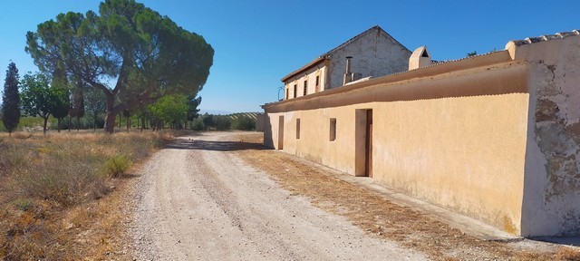 Rural property in Benamaurel, Granada, featuring traditional architecture and scenic surroundings.