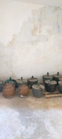 Clay pots and jars on display in a rural Spanish property in Benamaurel, Granada.