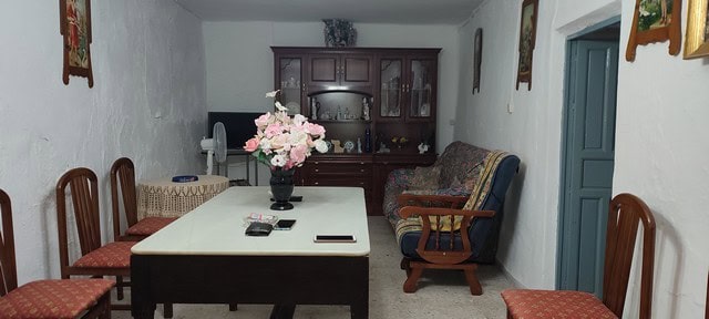 Interior view of a traditional village property in Somontin, Almeria, featuring a dining area with v.