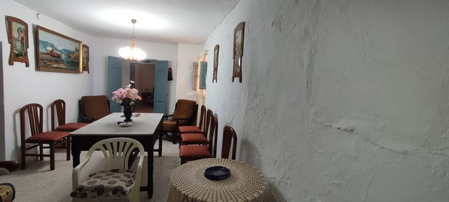 Interior view of a traditional village property in Somontin, Almeria, featuring a dining area with v.