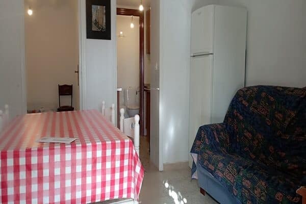 Cozy interior of a rural property in Rosales, Jaen, featuring a dining area and living space.
