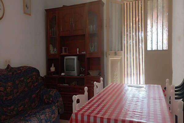 Charming rural home interior with dining area and vintage furniture in Rosales, Jaen.