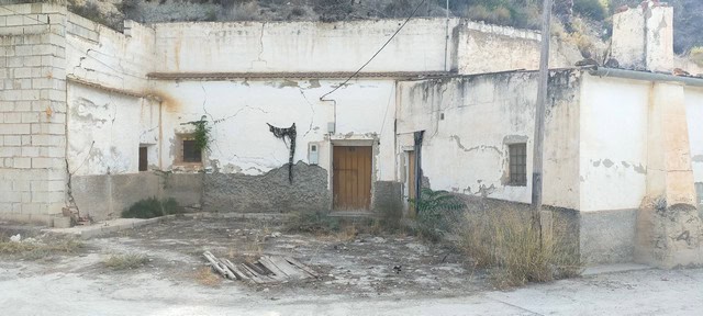 Cave house in Cortes de Baza, Granada, with rustic exterior and traditional architecture.