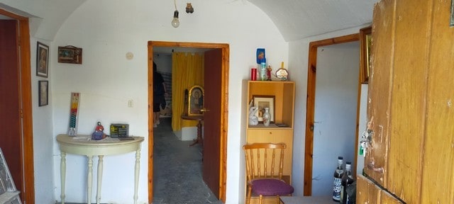 Charming cave house interior in Cortes de Baza, Granada, featuring rustic decor and cozy living spac.