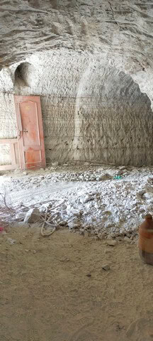 Unique cave house in Cortes de Baza, Granada with rustic interior and natural rock walls.