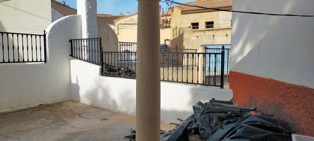 Traditional cave house in Benamaurel, Granada, with outdoor space and rustic surroundings.