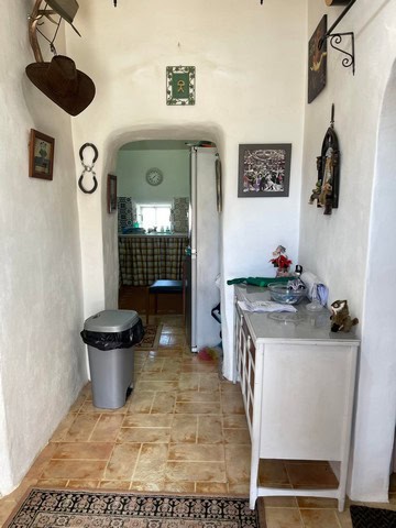 Charming interior view of a village home in Gor, Granada, featuring rustic decor and traditional Spa.