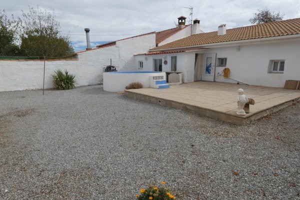 Charming village home in Gor, Granada featuring a spacious outdoor patio, garden, and traditional Sp.