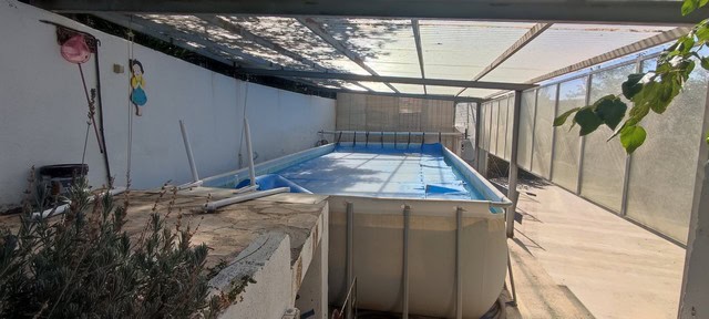 Pool area of a cave house in Caniles, Granada, with a private swimming pool and outdoor space.