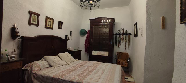 Cave house interior in Caniles, Granada, featuring rustic decor and traditional furnishings.
