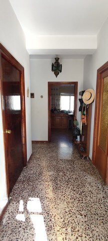 Charming villa entrance in Armuna, Almeria with traditional decor and wooden doors.