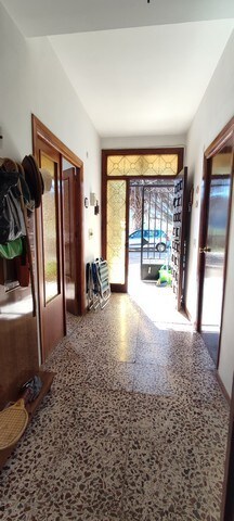 Charming villa entrance in Armuna, Almeria with bright natural light and traditional decor.
