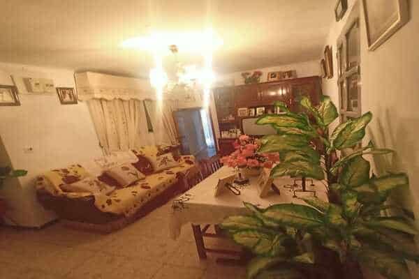 Interior view of a rural property in Don Pedro, Jaen, showcasing a comfortable living room with trad.