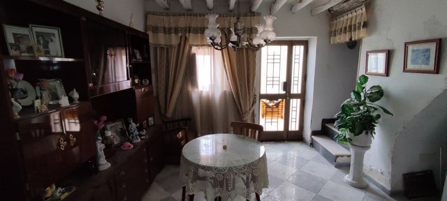 Charming interior of a town house in Tijola, Almeria, featuring a cozy living room with natural ligh.