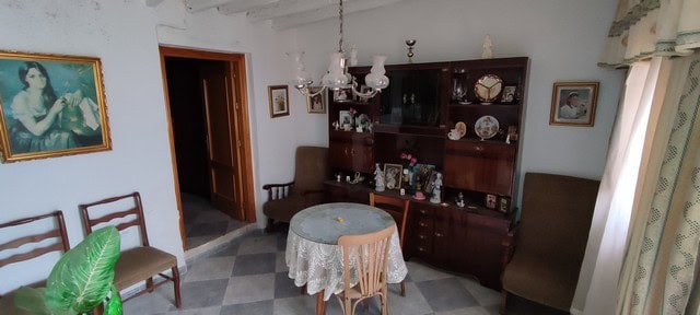 Cozy interior of a traditional town house in Tijola, Almeria, featuring vintage furniture and classi.