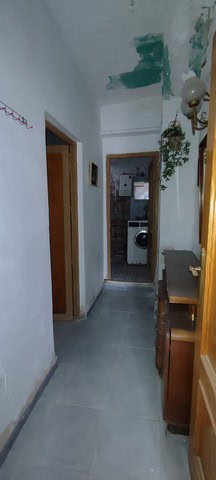 Charming town house interior in Tijola, Almeria, featuring a laundry area and traditional decor.