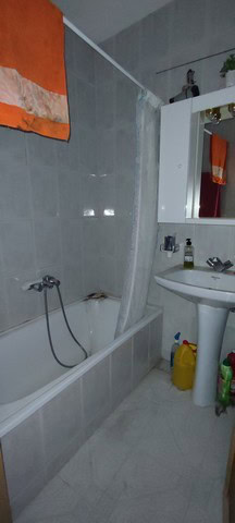 Cozy town house bathroom in Tijola, Almeria with bathtub, sink, and modern fixtures.