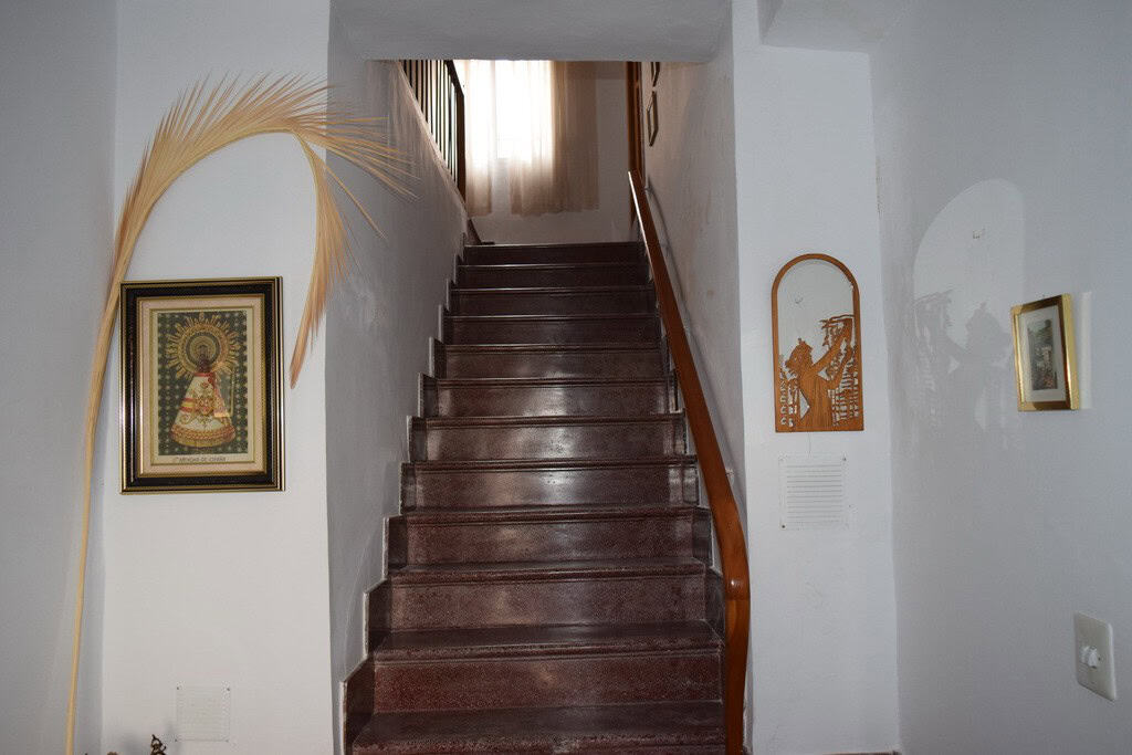 Interior staircase leading to upper floor in Caniles village property, Granada, Spain.
