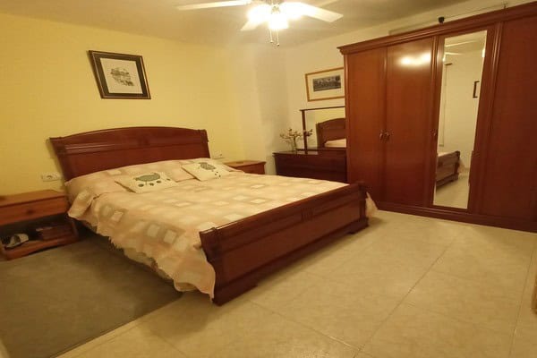 Charming bedroom in village property in Hinojares, Jaen with wooden furniture and cozy decor.