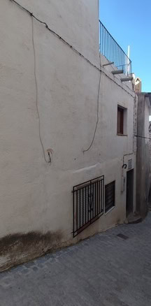 Charming village property in Seron, Almeria with rustic exterior and outdoor staircase. Ideal for re.