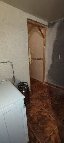 Charming village property in Seron, Almeria, featuring a rustic interior with a small doorway and ti.