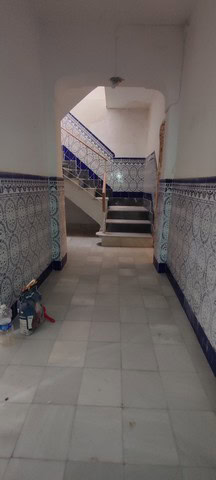 Charming village property with traditional tiled walls and staircase in Armuna, Almeria. Ideal for r.