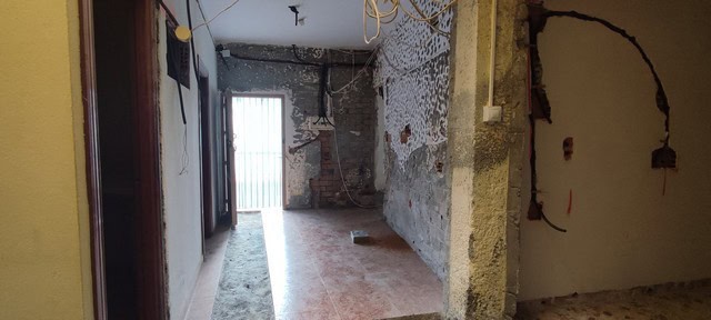 Interior view of a rustic village property in Armuna, Almeria, showing unfinished walls and exposed.