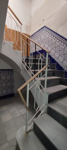 Village staircase with decorative blue tiles in Armuna, Almeria.
