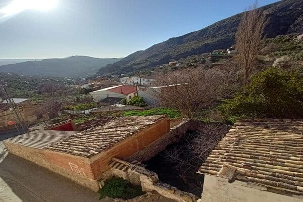 Rural property in Don Pedro, Jaen, with scenic mountain views and traditional architecture.