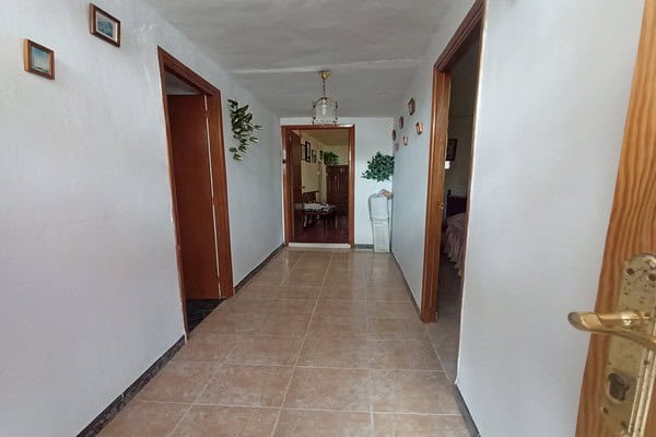 Interior hallway of rural property in Don Pedro, Jaen, with tiled floors and simple decor.